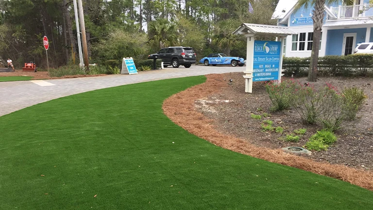 Commercial landscape in Huntsville with Southern Greens' eco-friendly synthetic turf, ideal for business properties seeking sustainable lawns.