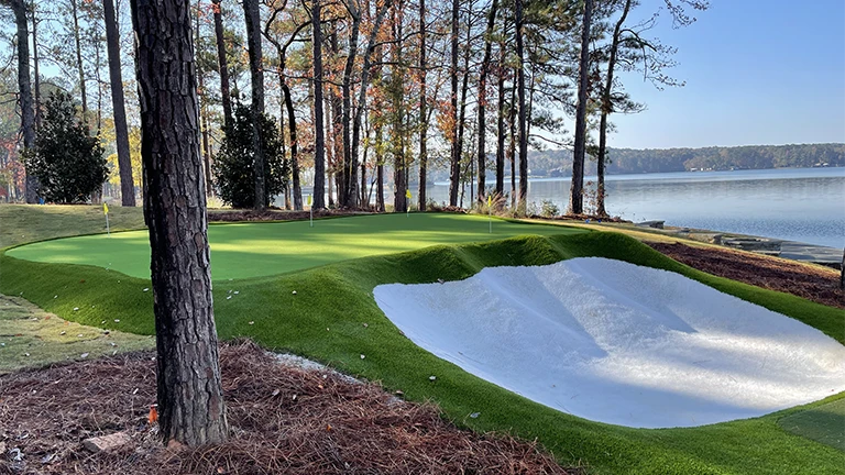 Custom putting green design by Southern Greens in a Huntsville residence, featuring professional-grade synthetic grass for golf enthusiasts.